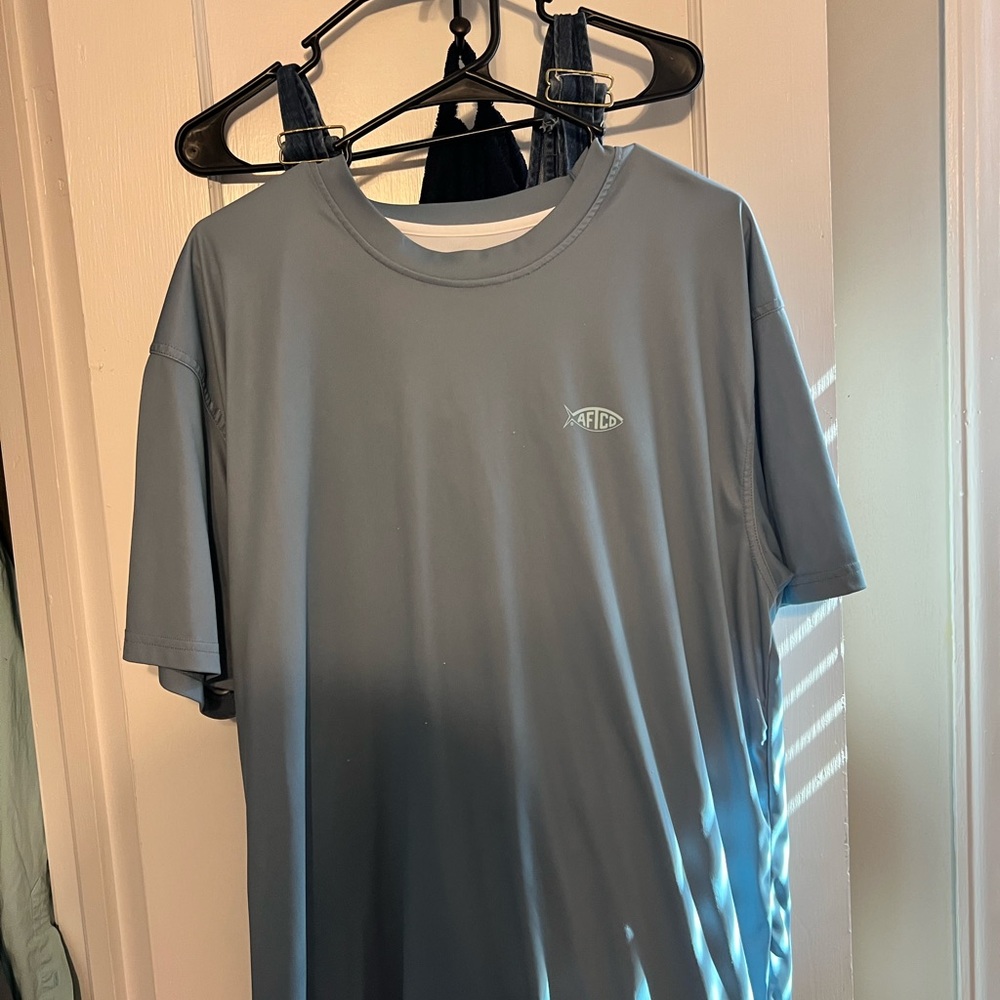 American fishing tackle shirt .